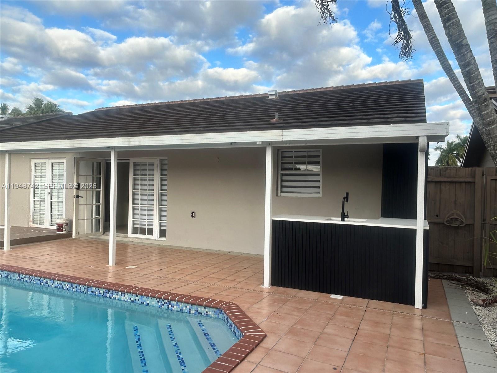 9752 Southwest 145th Place, Unit 9752 Miami, FL 33186 - Photo 17 of 17 a view of a terrace