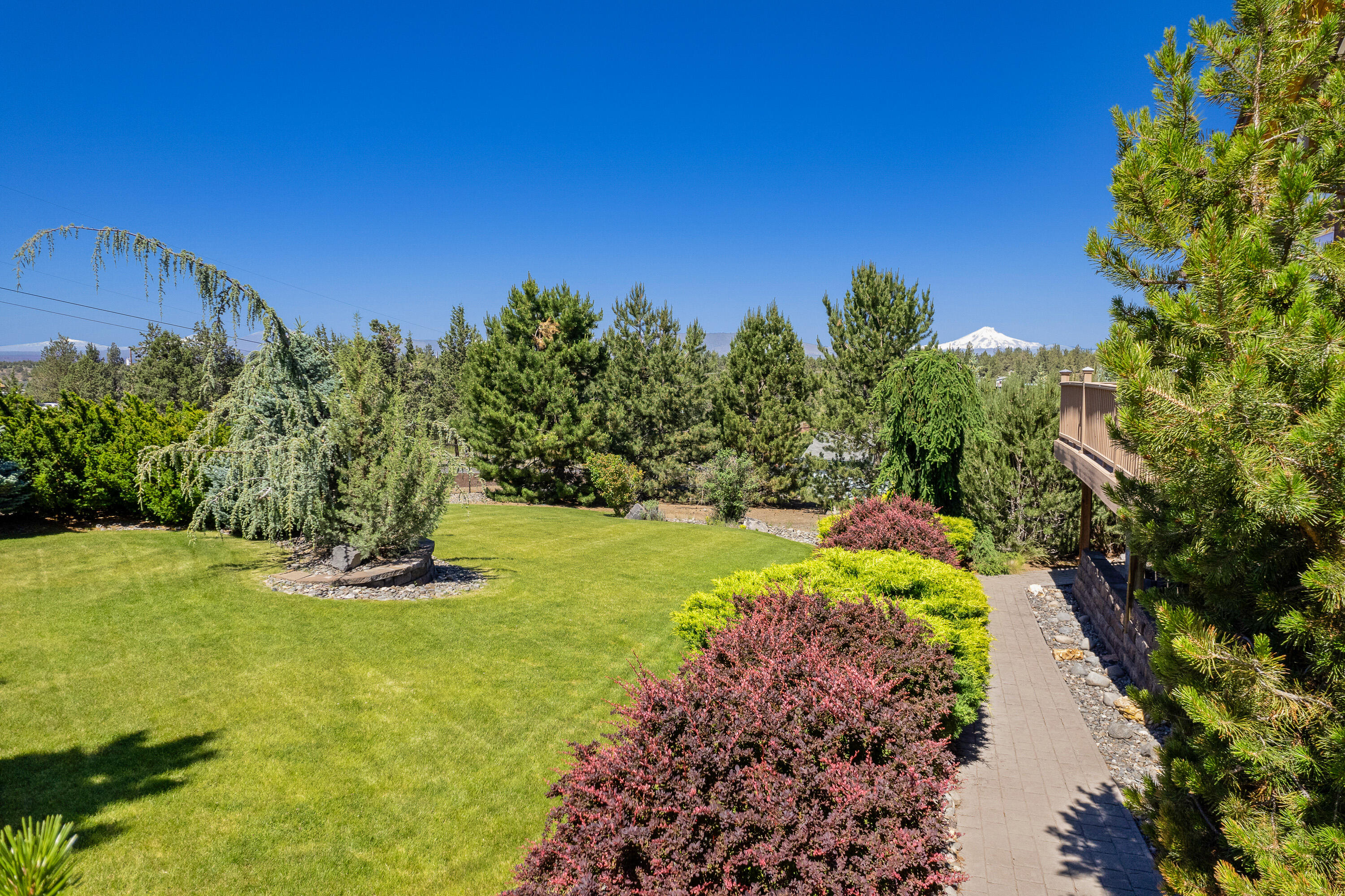 9403 Southwest Panorama Road Terrebonne, OR 97760 - Photo 8 of 51 Beautiful mature landscape with sprinkler system.