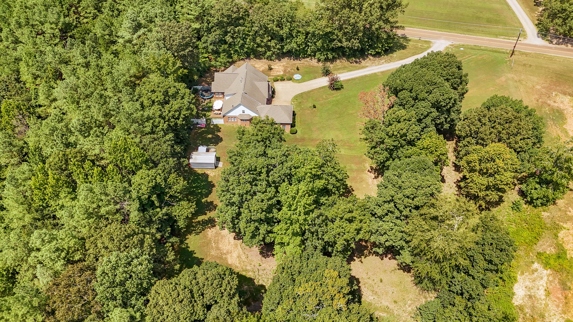 915 Cliffview Road Bolivar, TN 38008 - Photo 3 of 89 an aerial view of residential house with outdoor space and trees all around