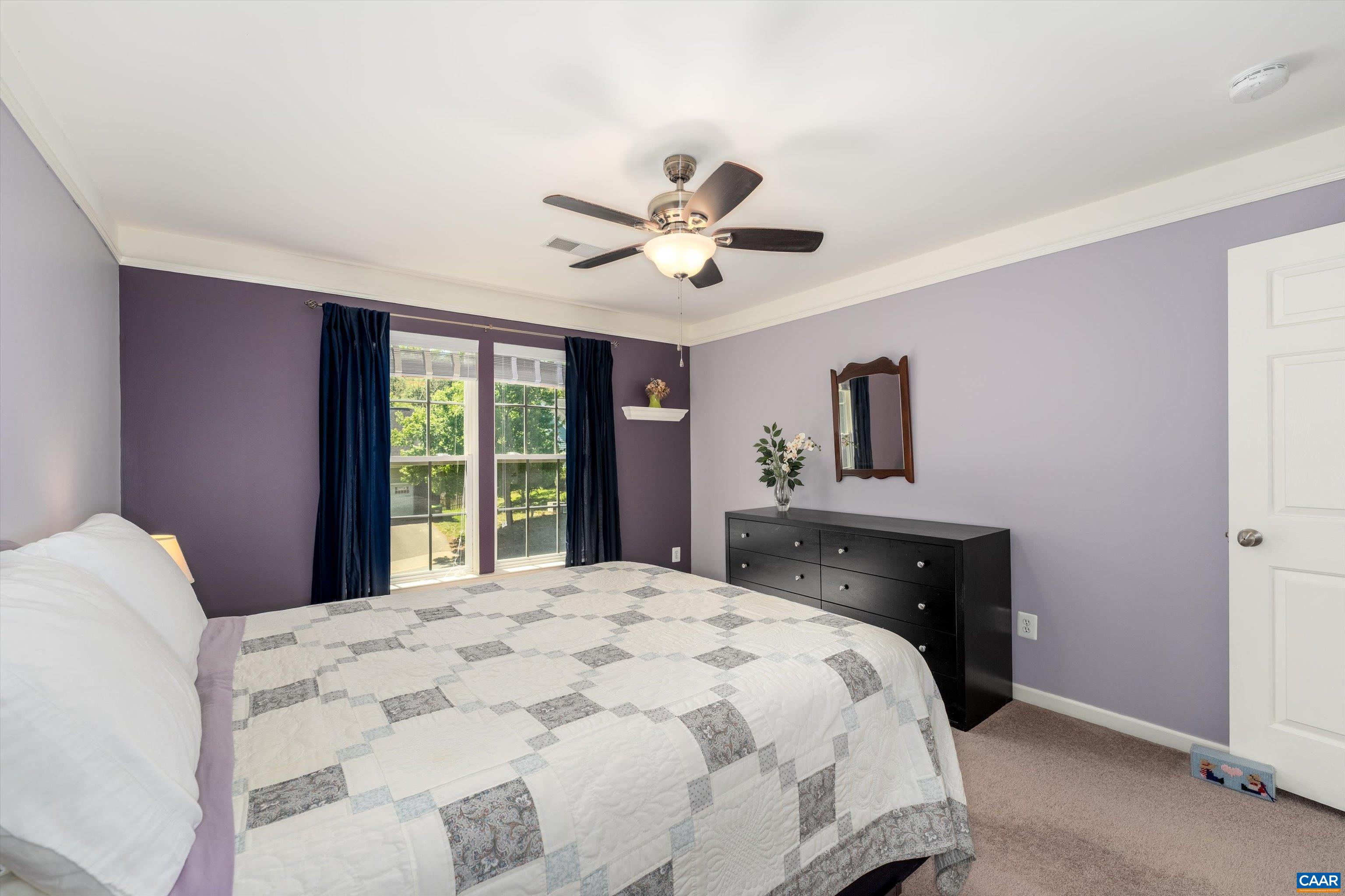 5366 Park Road Crozet, VA 22932 - Photo 49 of 61 a bedroom with a large bed and a chandelier