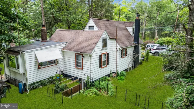 a house view with a outdoor seating