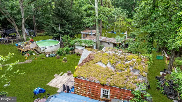 a car parked in front of a house with a garden
