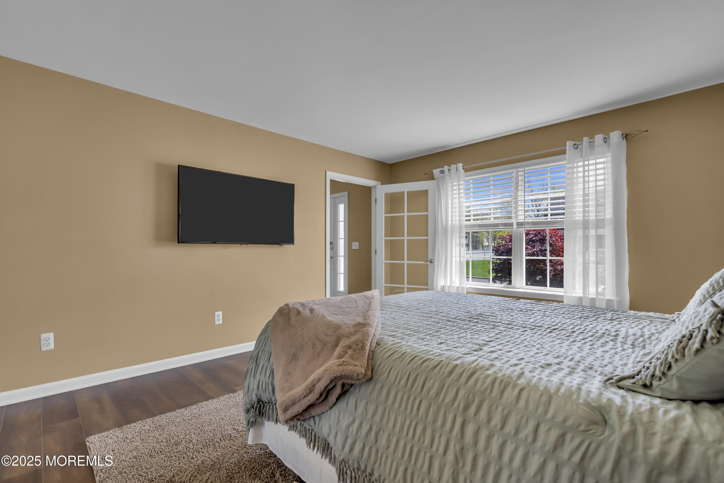 1839 Breakers Drive Manahawkin, NJ 08050 - Photo 14 of 52 a living room with couches bookshelf and a flat screen tv