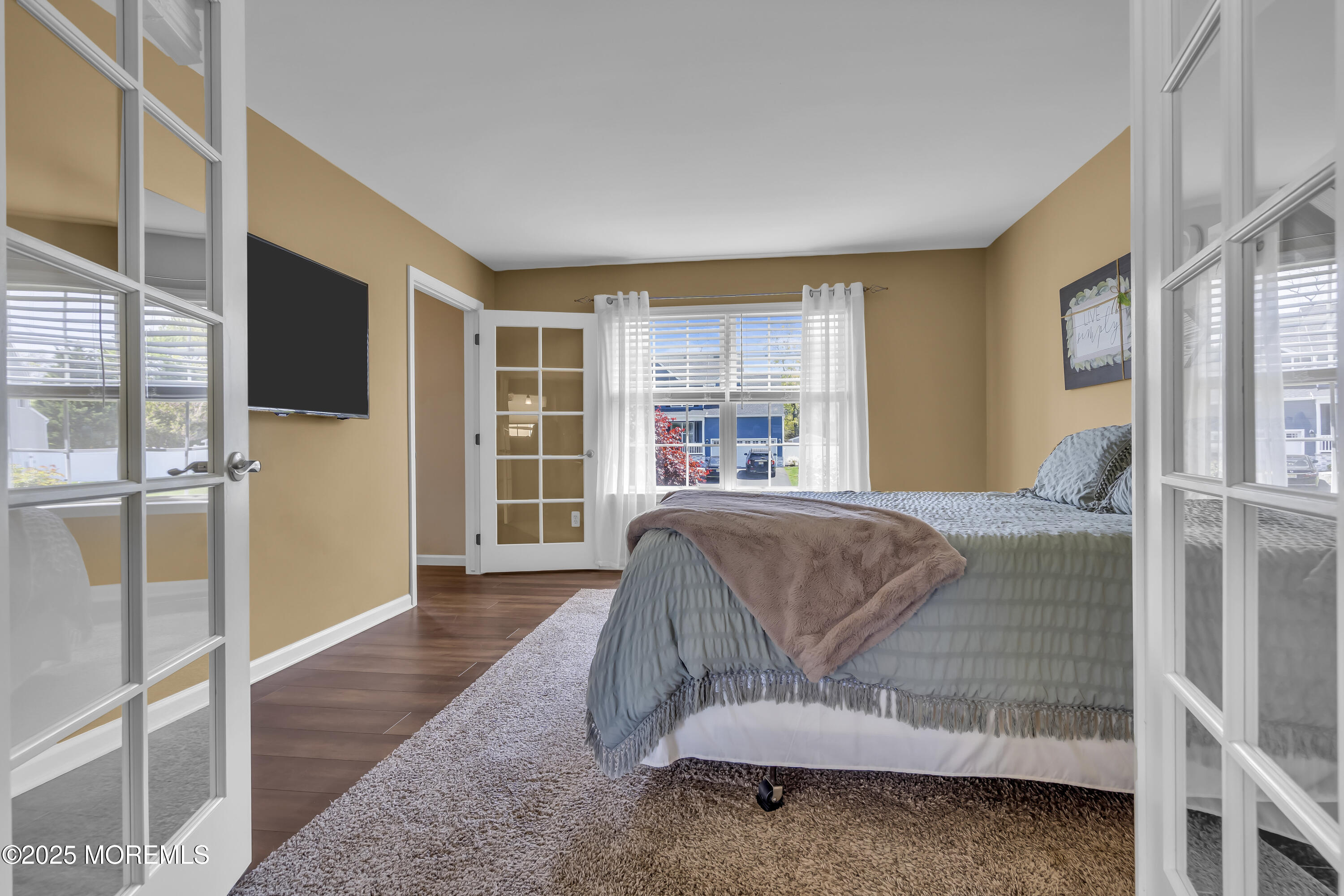 1839 Breakers Drive Manahawkin, NJ 08050 - Photo 15 of 52 a living room with a couch and a flat screen tv