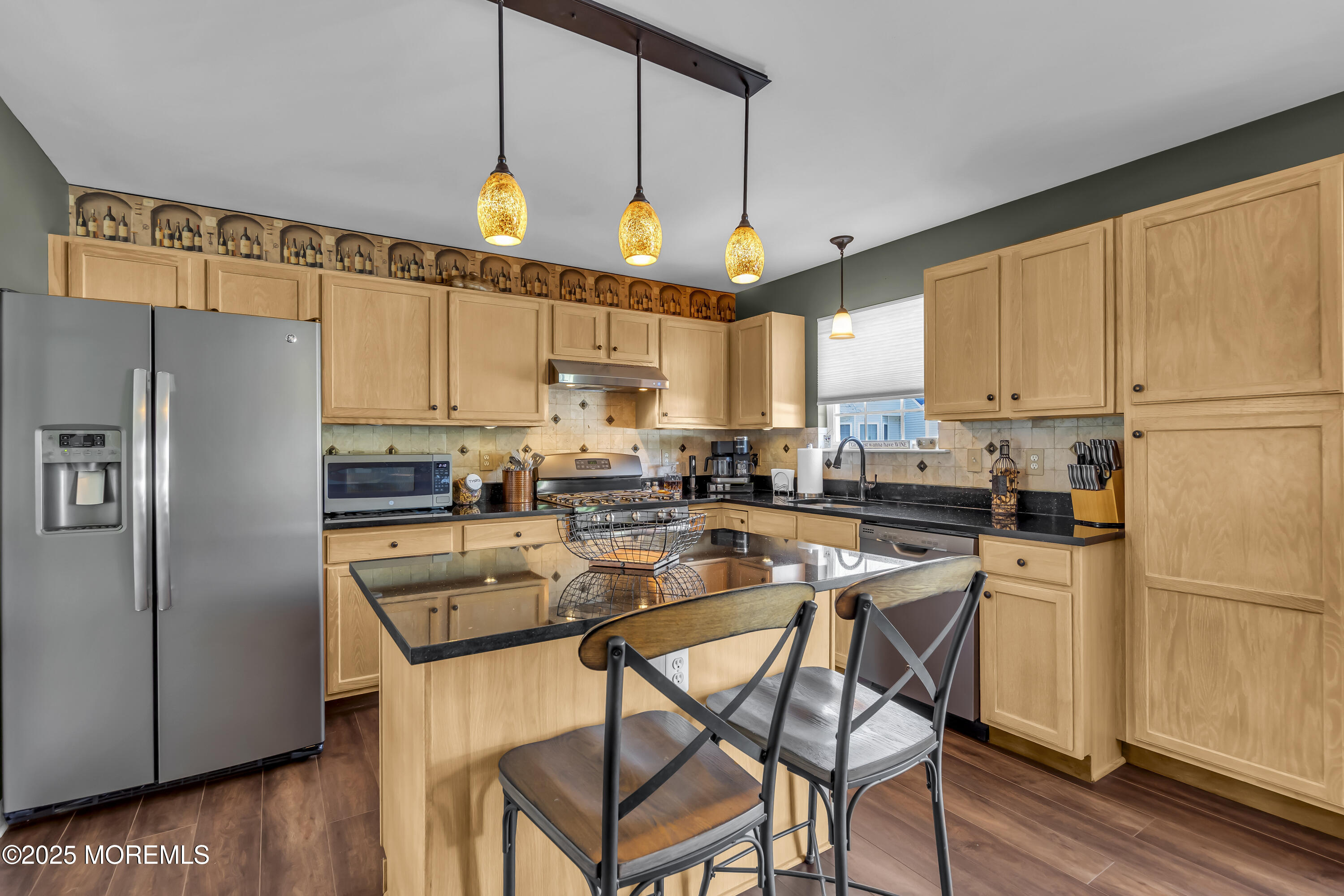 1839 Breakers Drive Manahawkin, NJ 08050 - Photo 20 of 52 a kitchen with stainless steel appliances a refrigerator a stove a sink dishwasher and a refrigerator with wooden floor