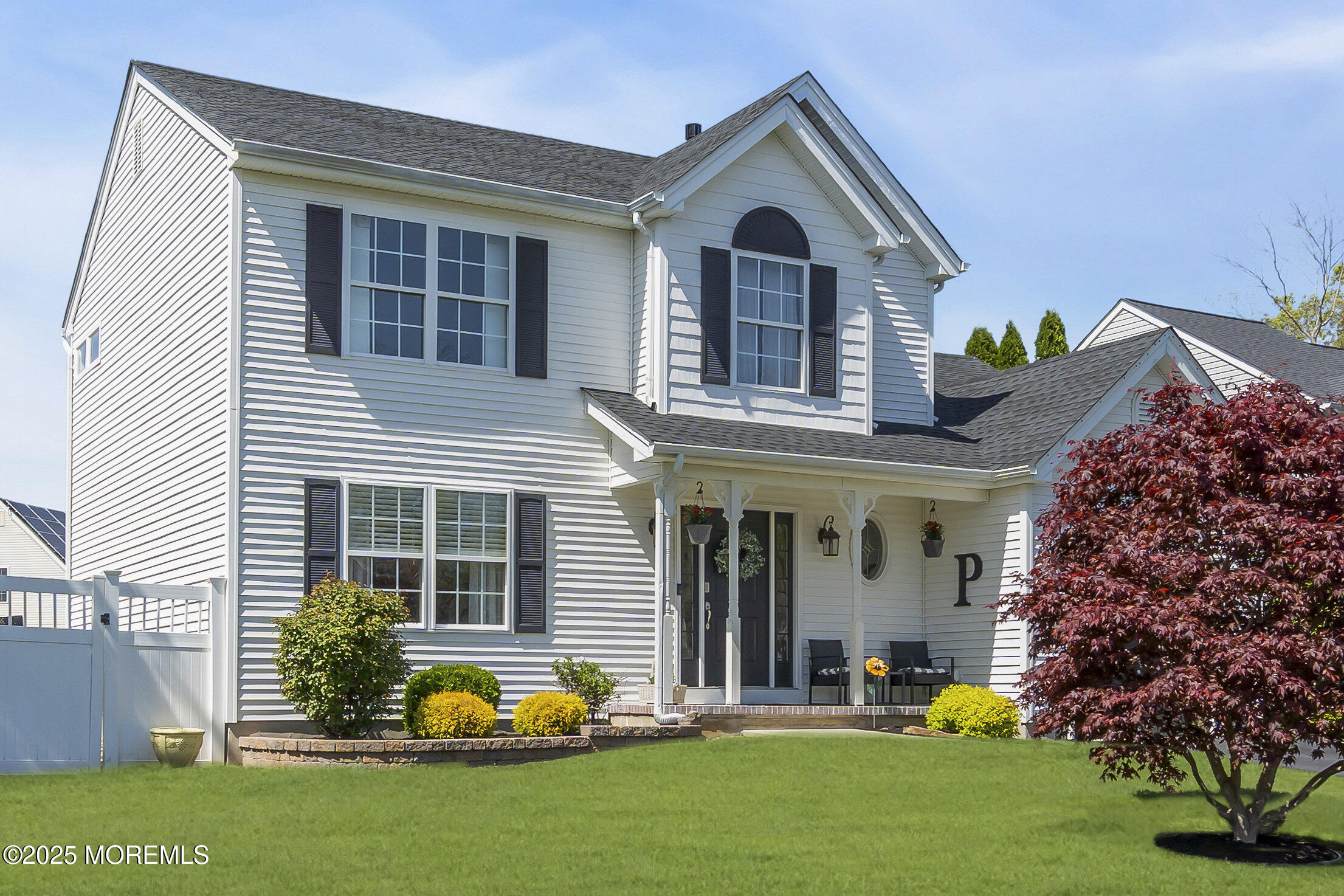 1839 Breakers Drive Manahawkin, NJ 08050 - Photo 2 of 52 a front view of a house with a yard and potted plants