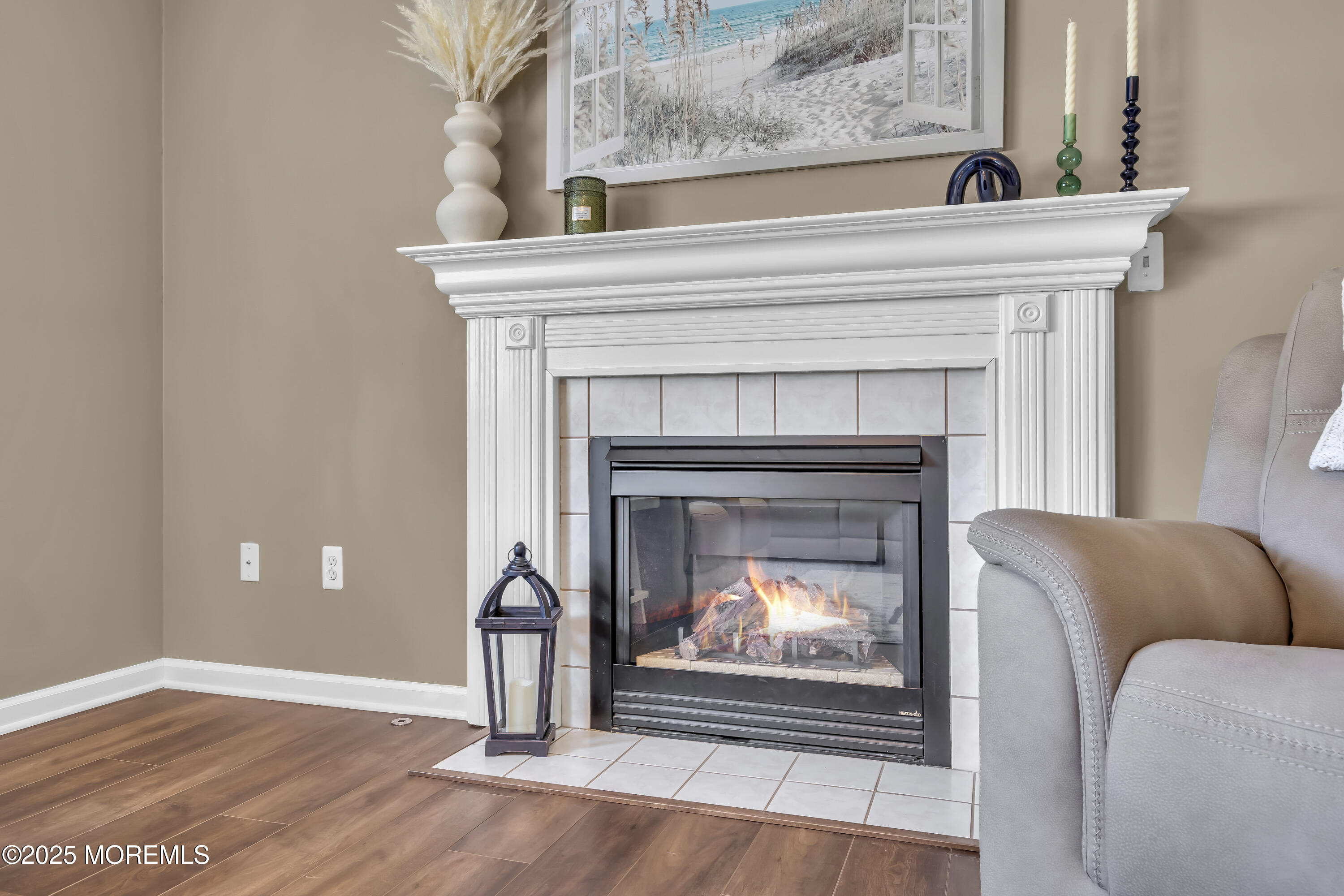 1839 Breakers Drive Manahawkin, NJ 08050 - Photo 28 of 52 a living room with furniture and a fireplace