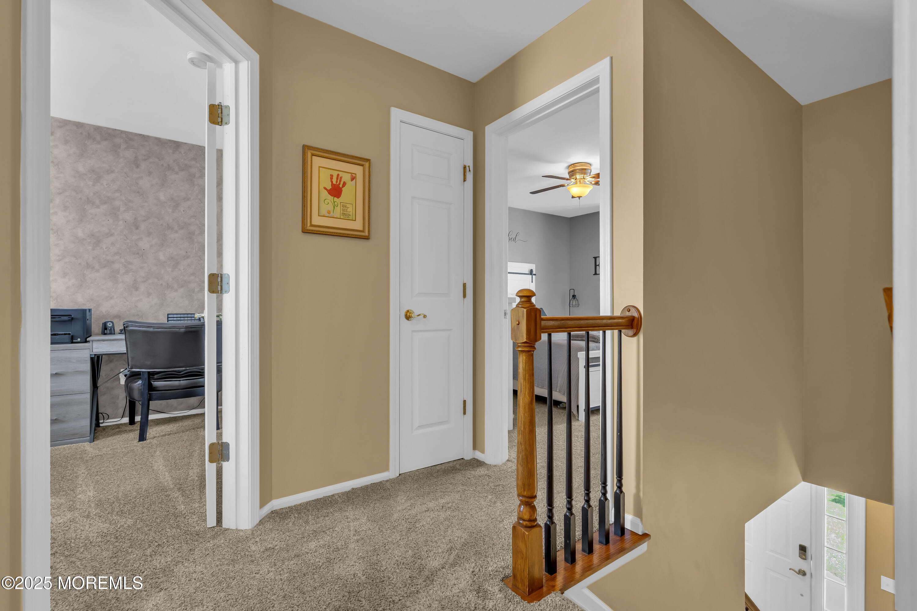 1839 Breakers Drive Manahawkin, NJ 08050 - Photo 29 of 52 a view of a hallway with wooden floor and a livingroom