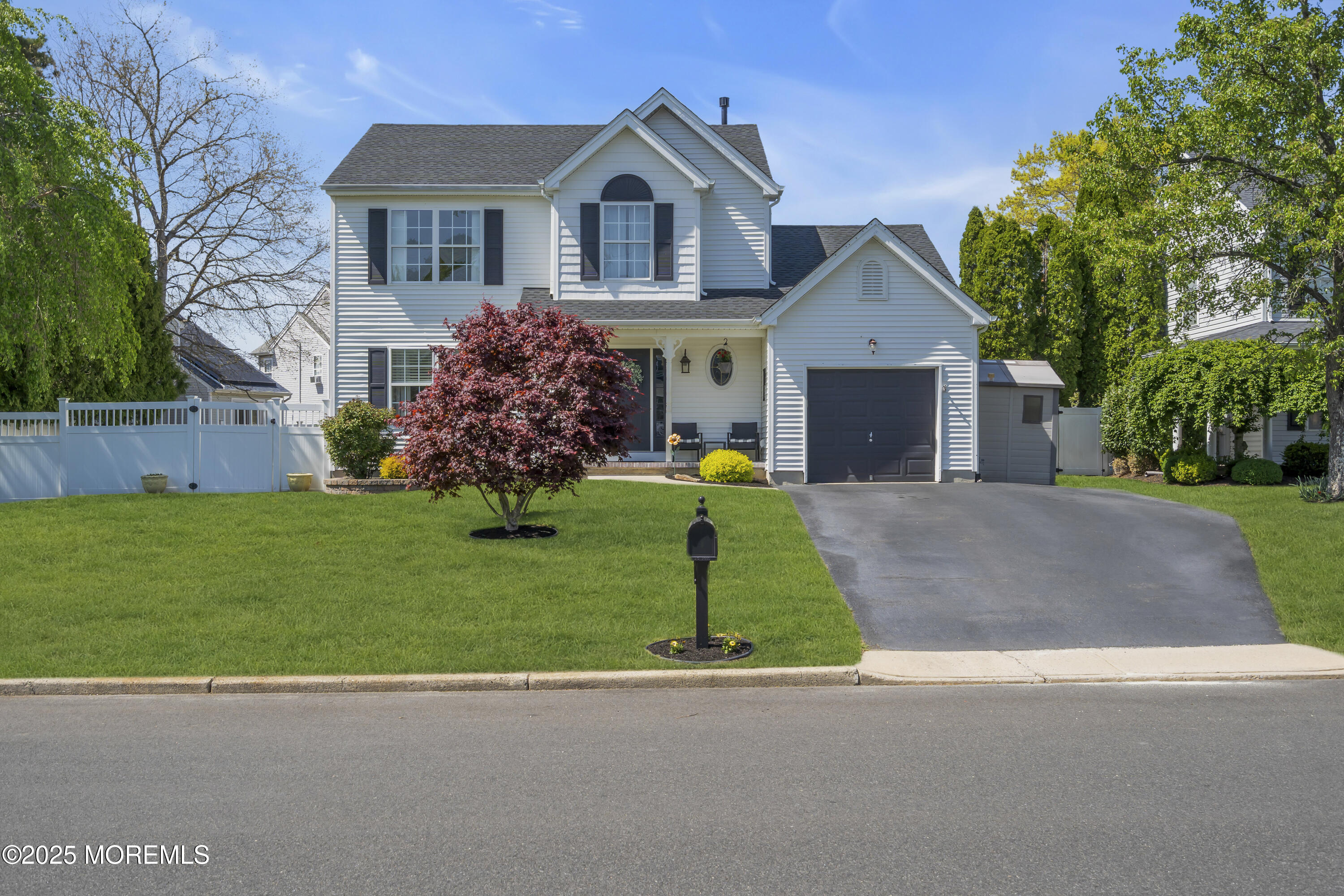 1839 Breakers Drive Manahawkin, NJ 08050 - Photo 3 of 52 a front view of house with yard and green space