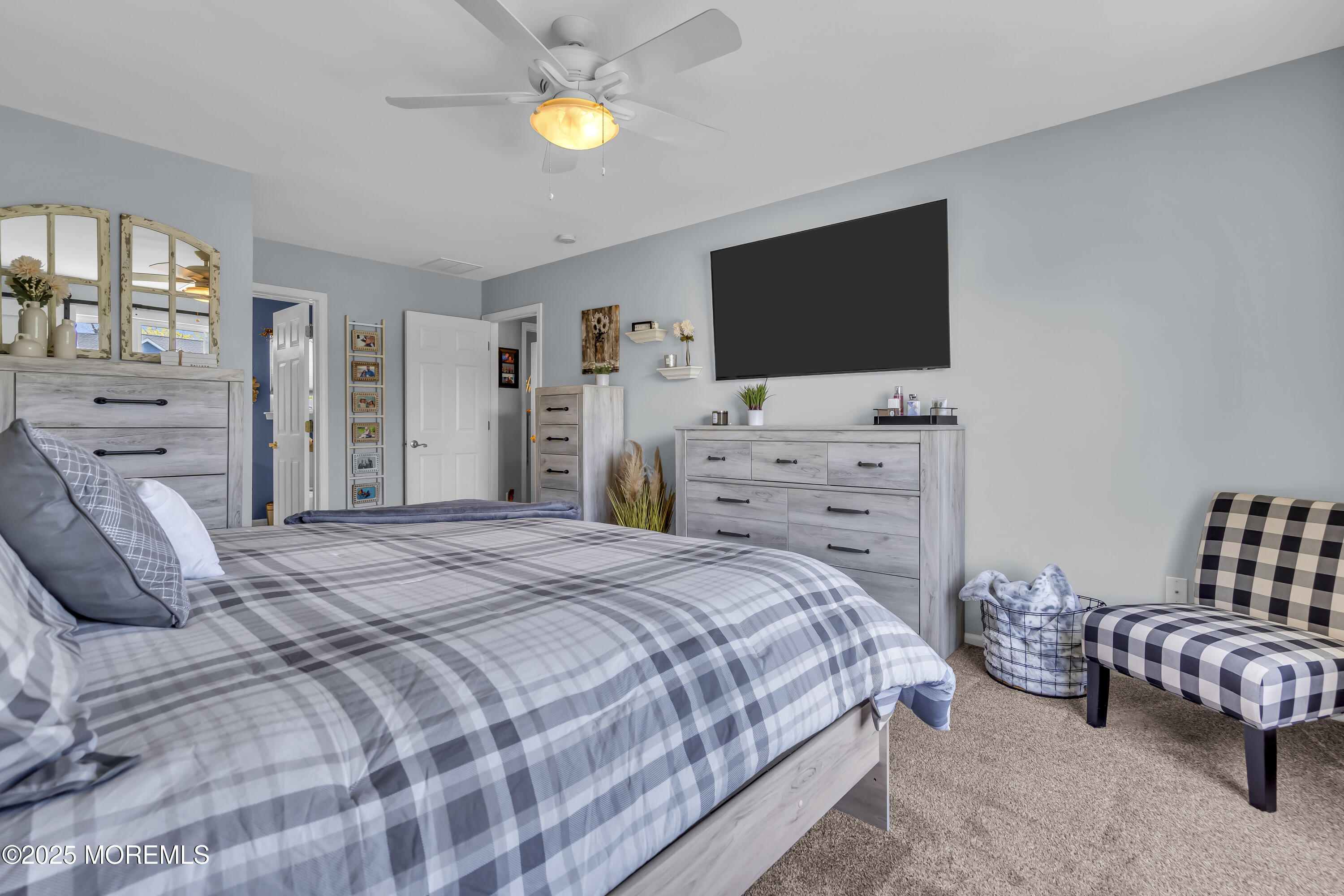 1839 Breakers Drive Manahawkin, NJ 08050 - Photo 32 of 52 a bedroom with a bed and flat screen tv