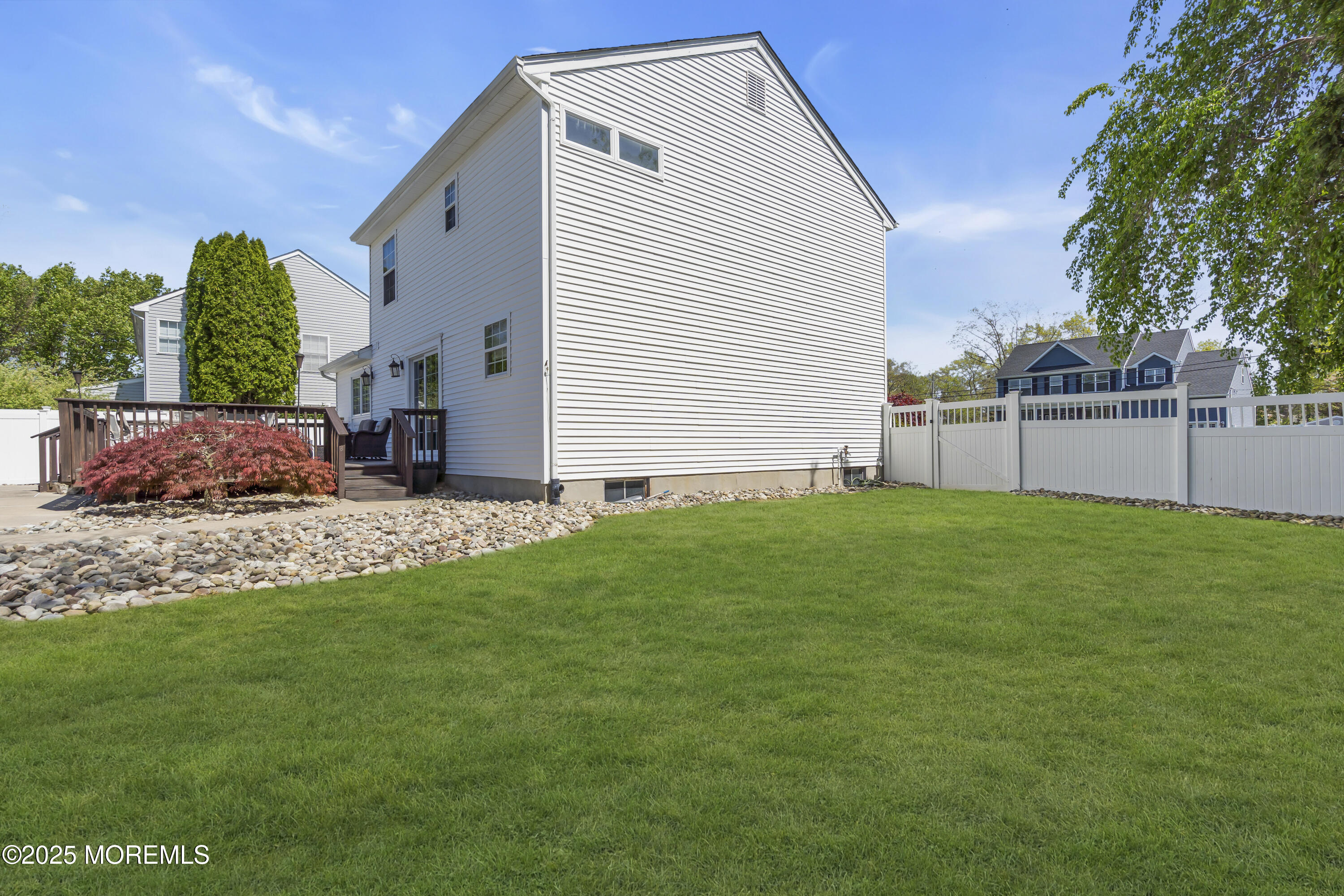1839 Breakers Drive Manahawkin, NJ 08050 - Photo 50 of 52 a view of a backyard with plants and large tree