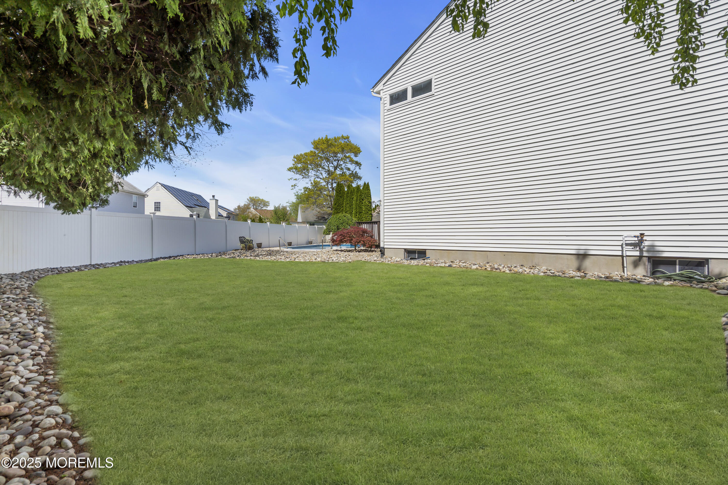 1839 Breakers Drive Manahawkin, NJ 08050 - Photo 52 of 52 a front view of house with a garden