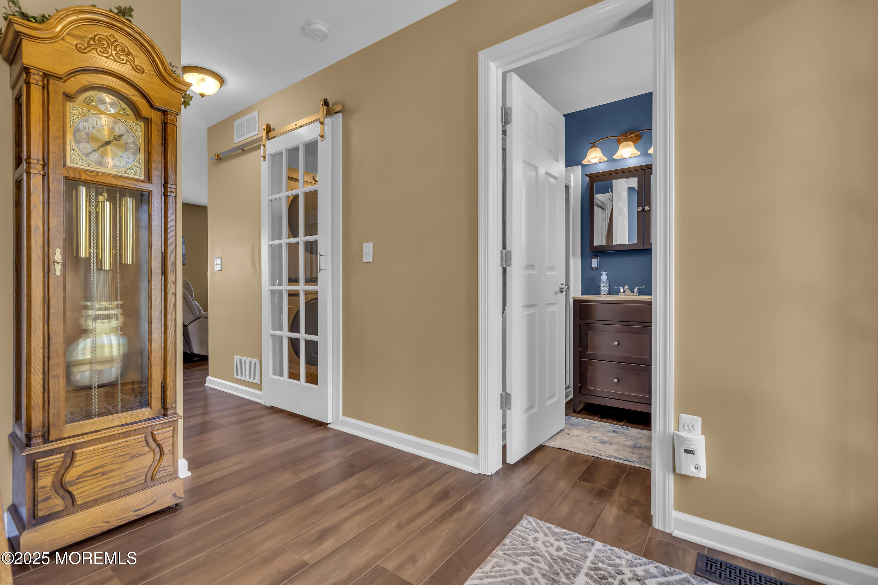 1839 Breakers Drive Manahawkin, NJ 08050 - Photo 9 of 52 a view of a hallway with wooden floor and closet
