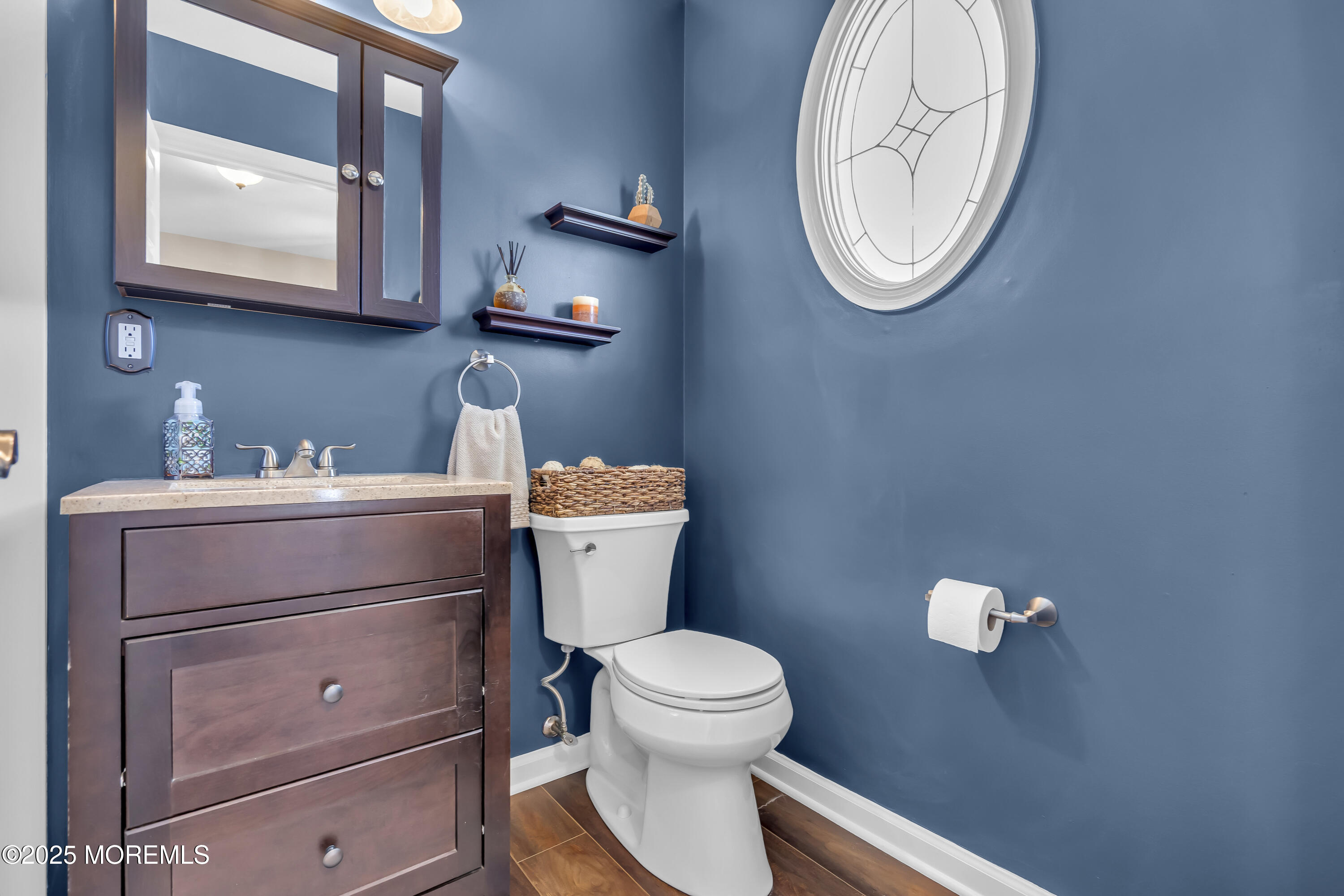 1839 Breakers Drive Manahawkin, NJ 08050 - Photo 10 of 52 a bathroom with a toilet and a mirror