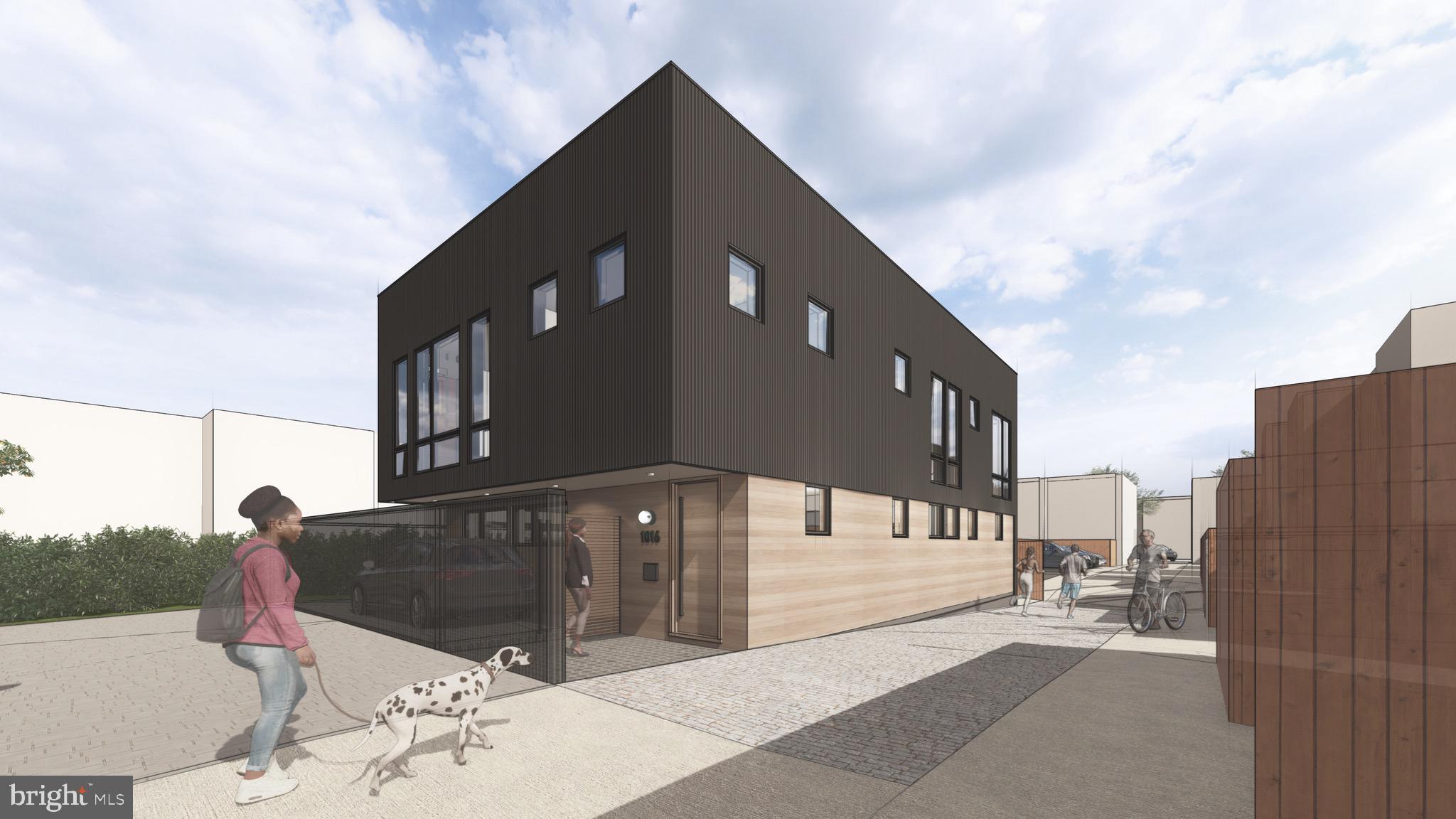 1016 Harvard Street Northwest Washington, DC 20001 - Photo 3 of 5 a front view of a building with many windows