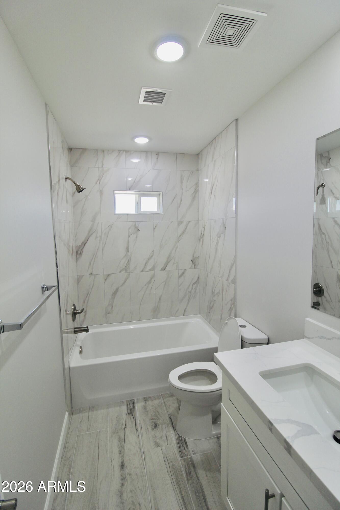 20275 East Mesa Verde Road, Unit 503 Mayer, AZ 86333 - Photo 13 of 32 a bathroom with a sink a toilet and shower