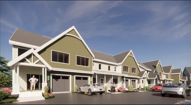 a front view of a residential houses with street