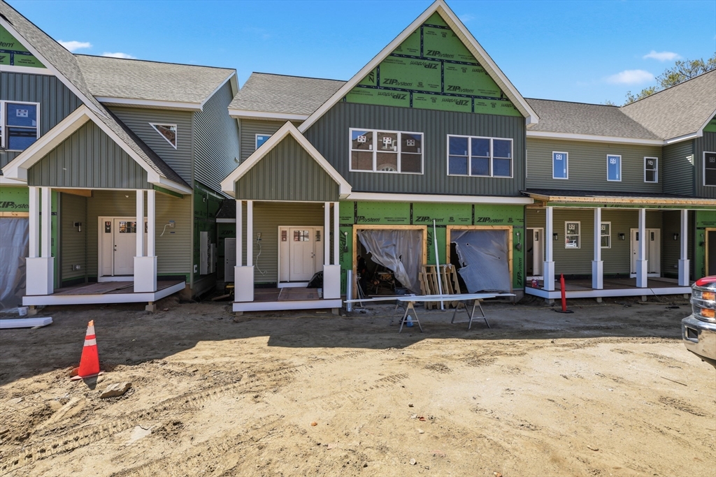 5 Elizabeth Lane, Unit 5 Paxton, MA 01612 - Photo 3 of 26 a front view of a house with a yard