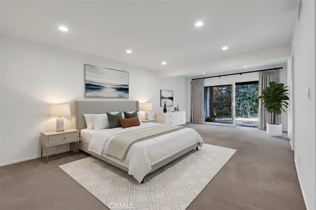 a view of a terrace with a bench and a garden