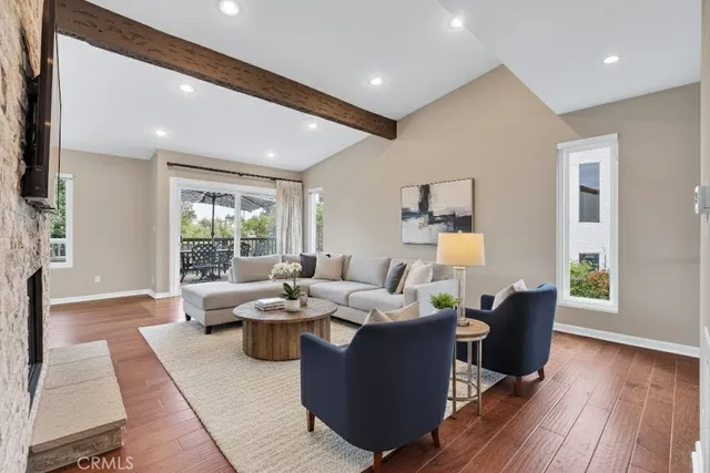 a kitchen with stainless steel appliances kitchen island granite countertop a table and chairs