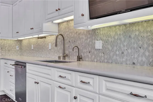 a bathroom with a granite countertop sink toilet a shower and a mirror