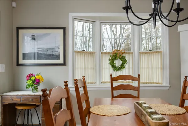 a dining room with furniture and window