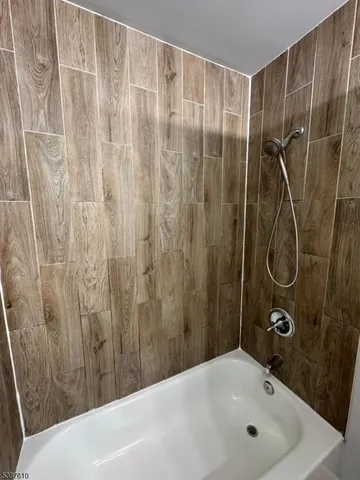 a bathroom with a sink a shower curtain and a window