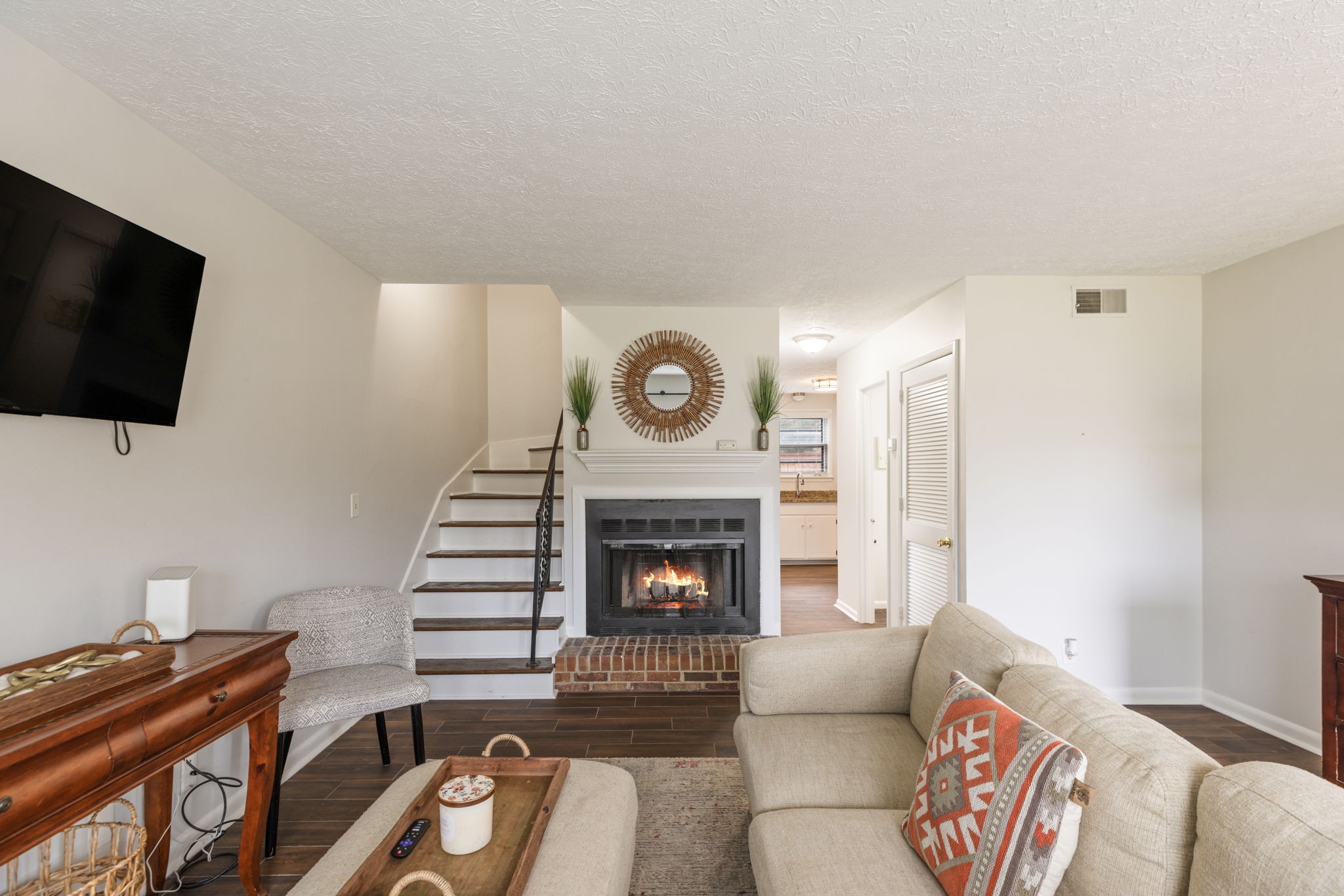 104 Meredith Place Franklin, TN 37064 - Photo 14 of 63 a living room with furniture a flat screen tv and a fireplace