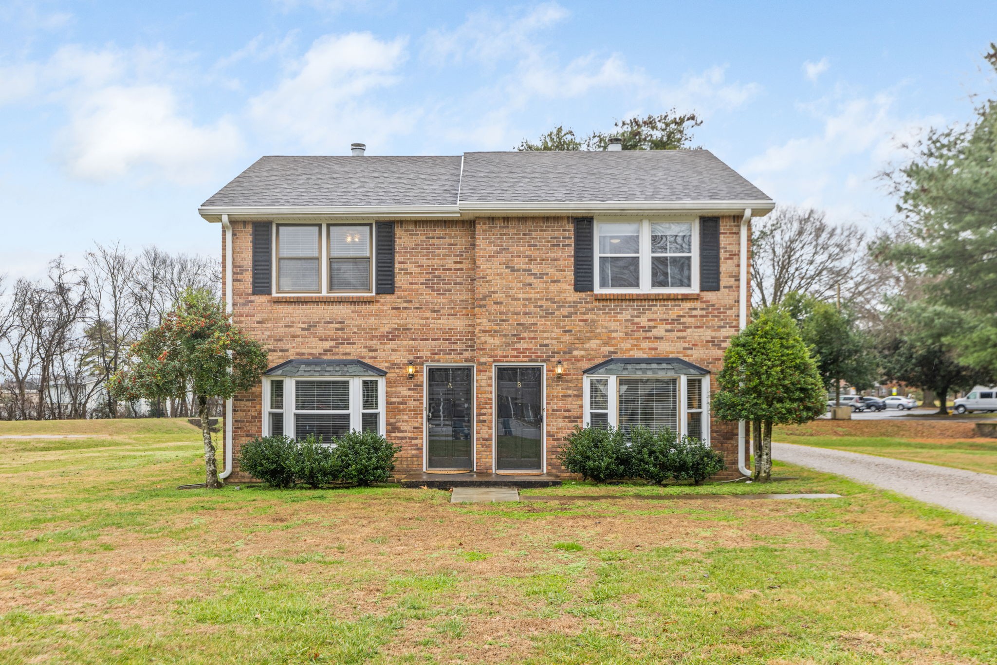 104 Meredith Place Franklin, TN 37064 - Photo 2 of 63 a front view of a house with a yard and trees
