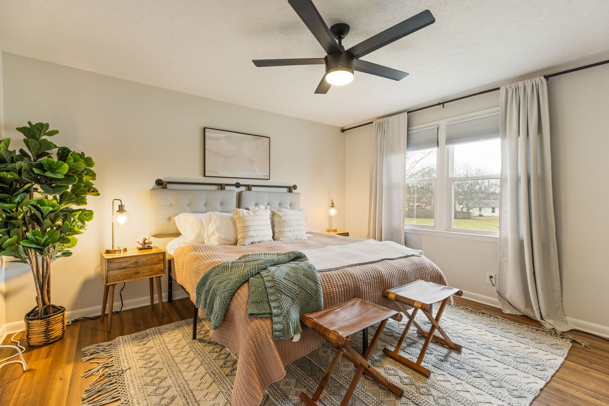 104 Meredith Place Franklin, TN 37064 - Photo 47 of 63 a bed room with a bed and a potted plant