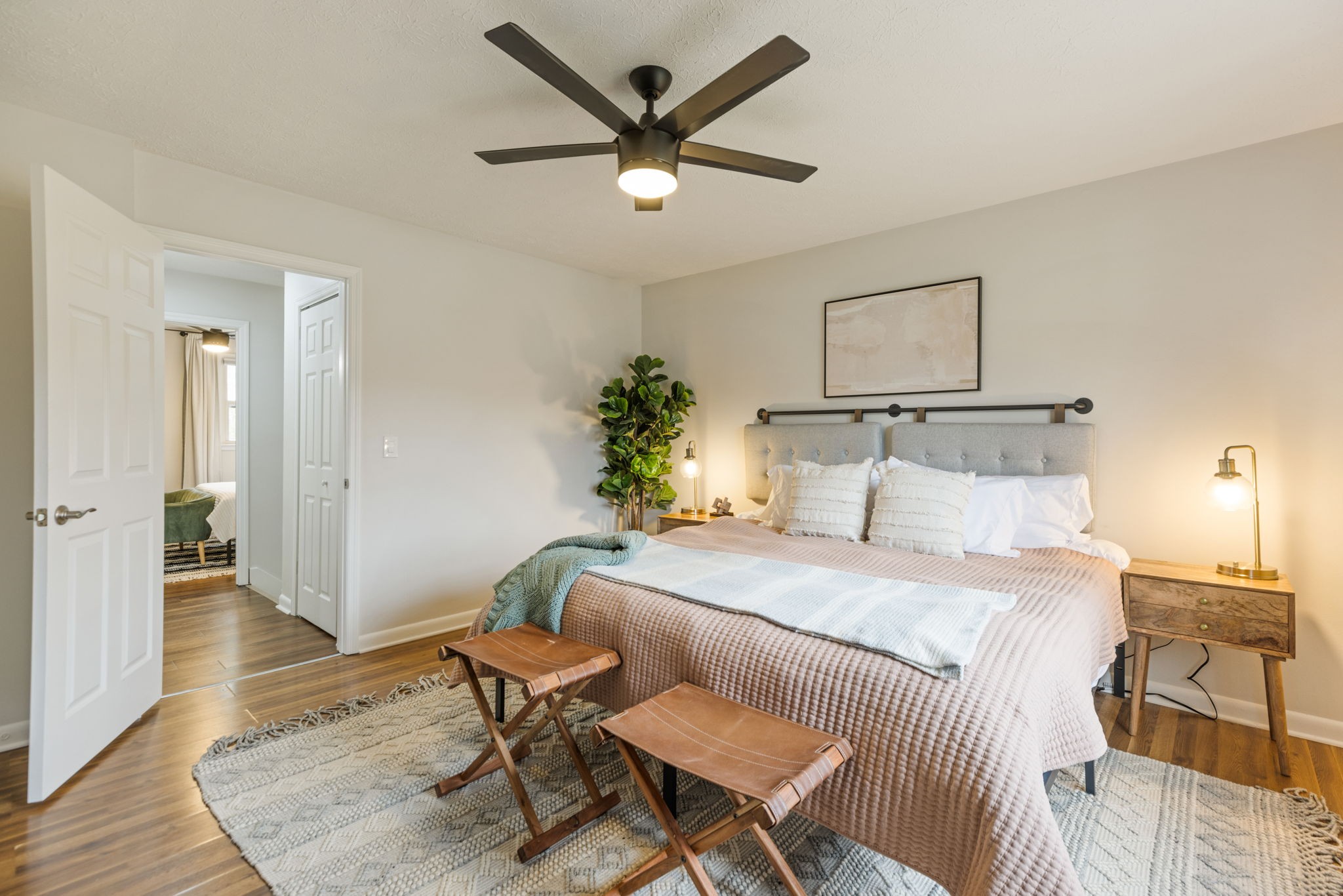 104 Meredith Place Franklin, TN 37064 - Photo 49 of 63 a bedroom with a bed and a chandelier