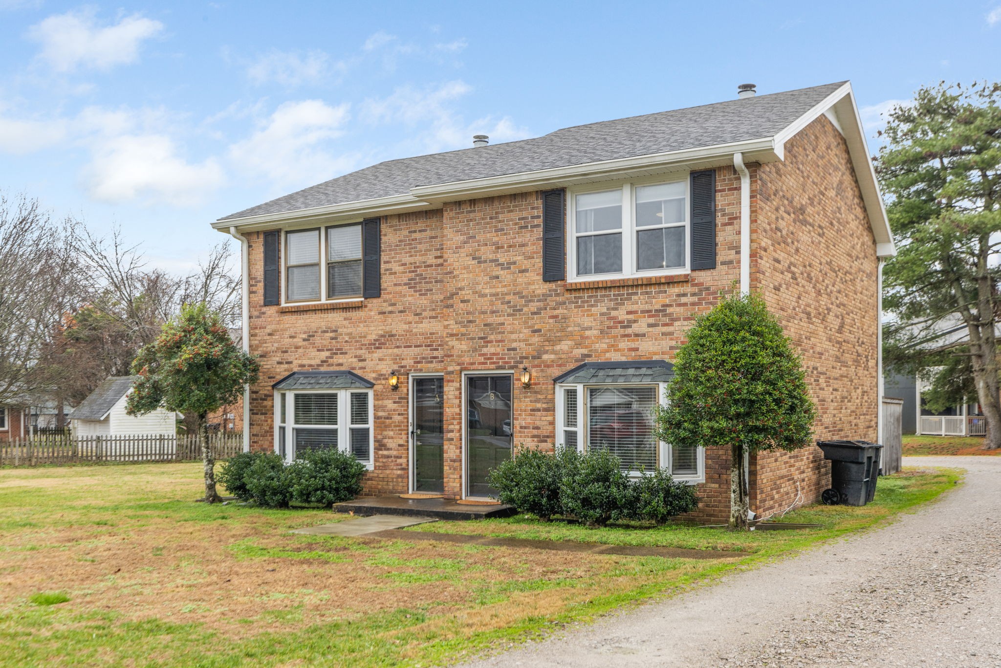 104 Meredith Place Franklin, TN 37064 - Photo 5 of 63 a front view of a house with a yard