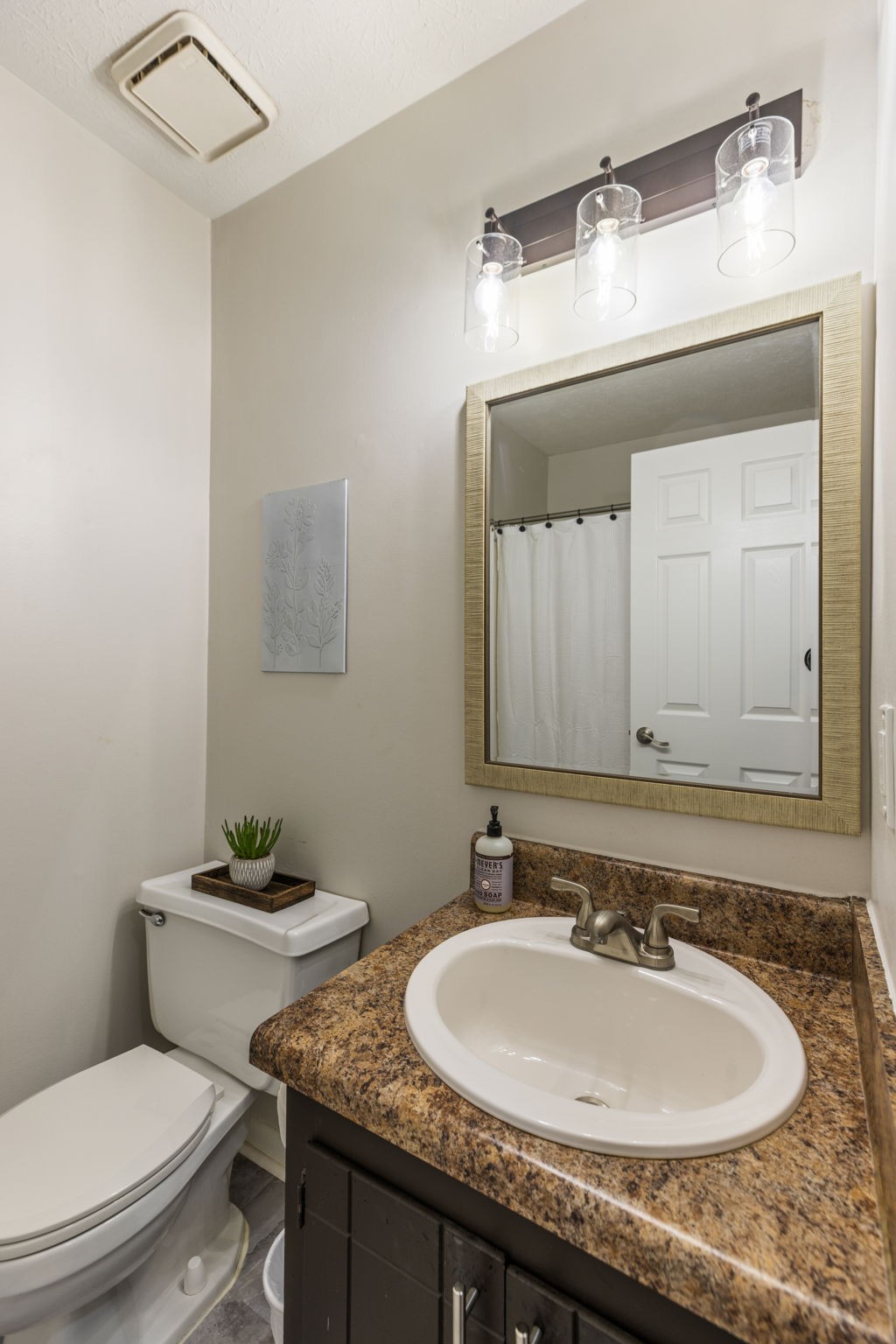 104 Meredith Place Franklin, TN 37064 - Photo 51 of 63 a bathroom with a granite countertop sink a toilet and a mirror