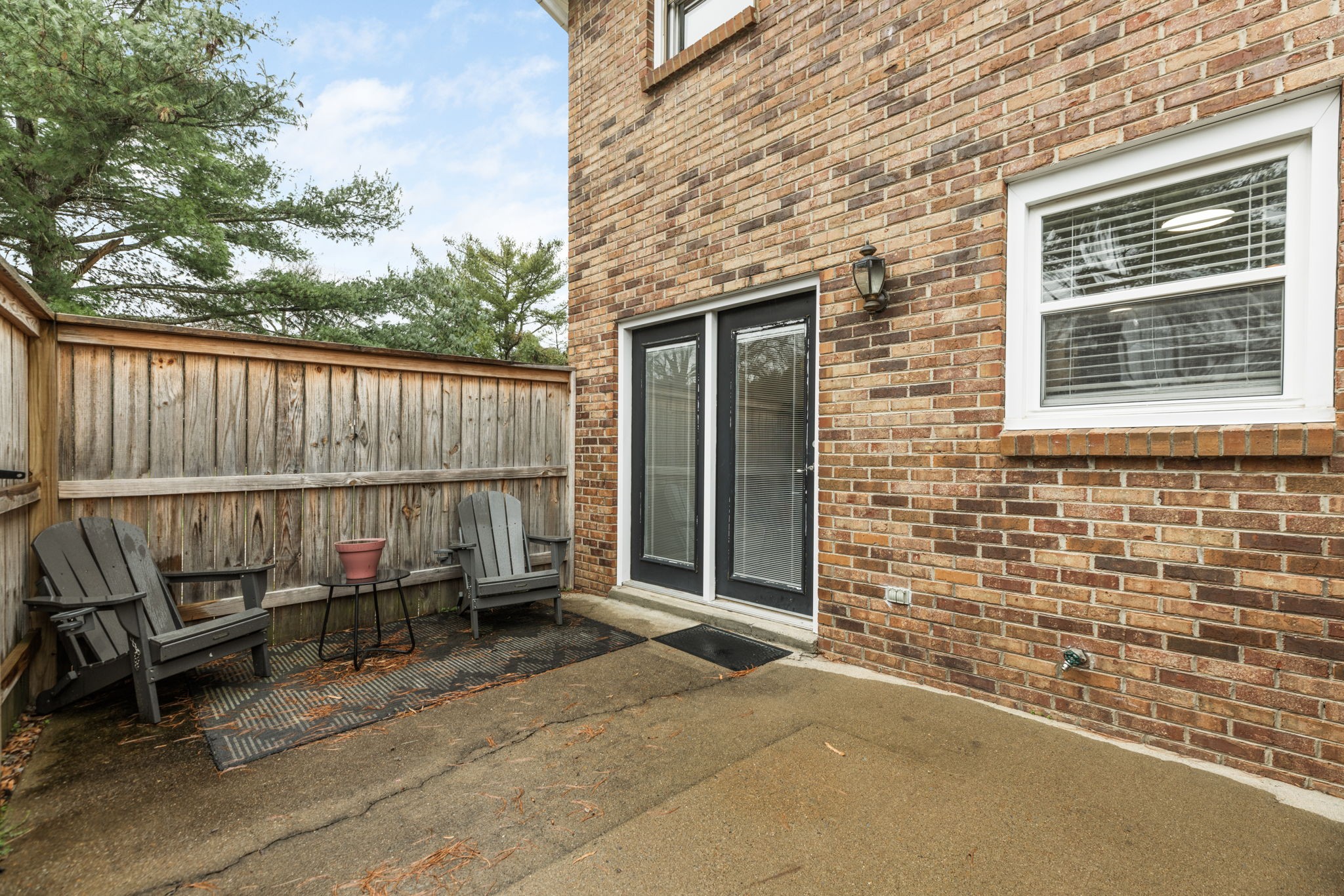 104 Meredith Place Franklin, TN 37064 - Photo 56 of 63 a backyard of a house with barbeque oven and outdoor seating