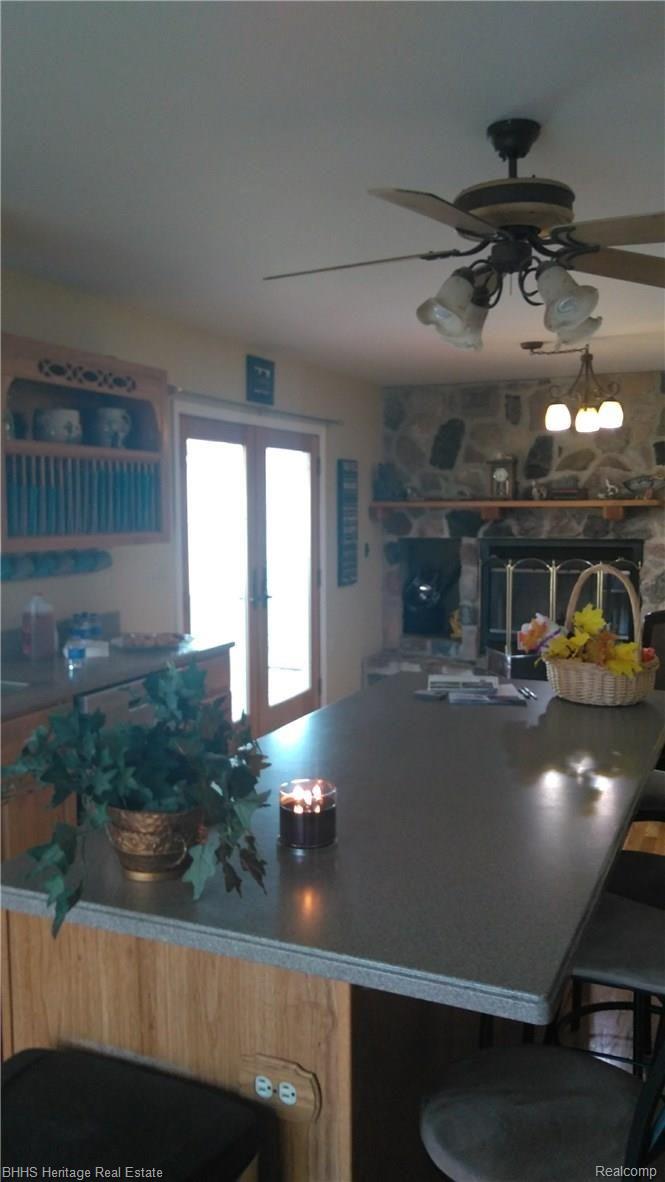 4444 Stow Road Fowlerville, MI 48836 - Photo 9 of 27 Kitchen with Fireplace