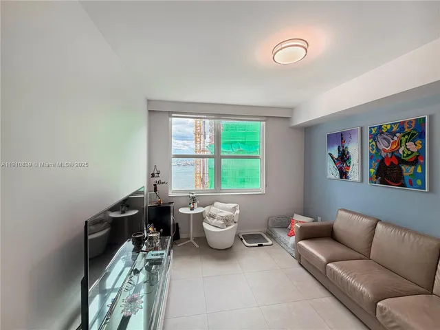 a view of walk in closet with clothes