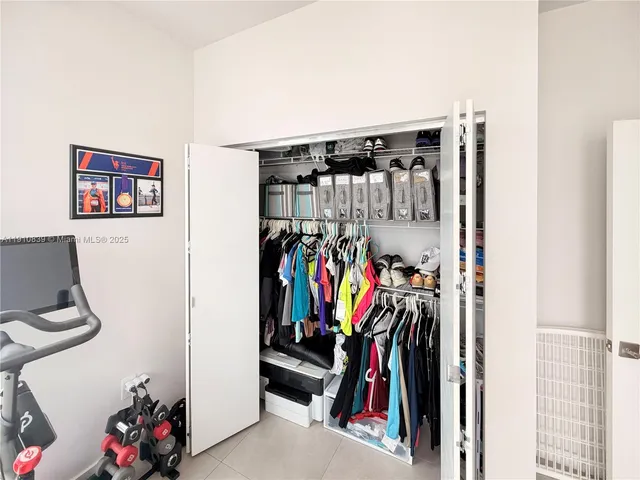 a kitchen with a refrigerator a stove a microwave and cabinets