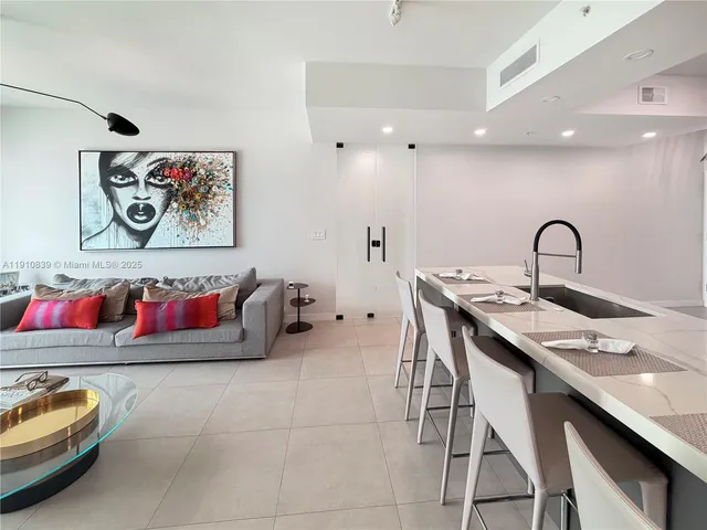 a hall with a sink and a table in it