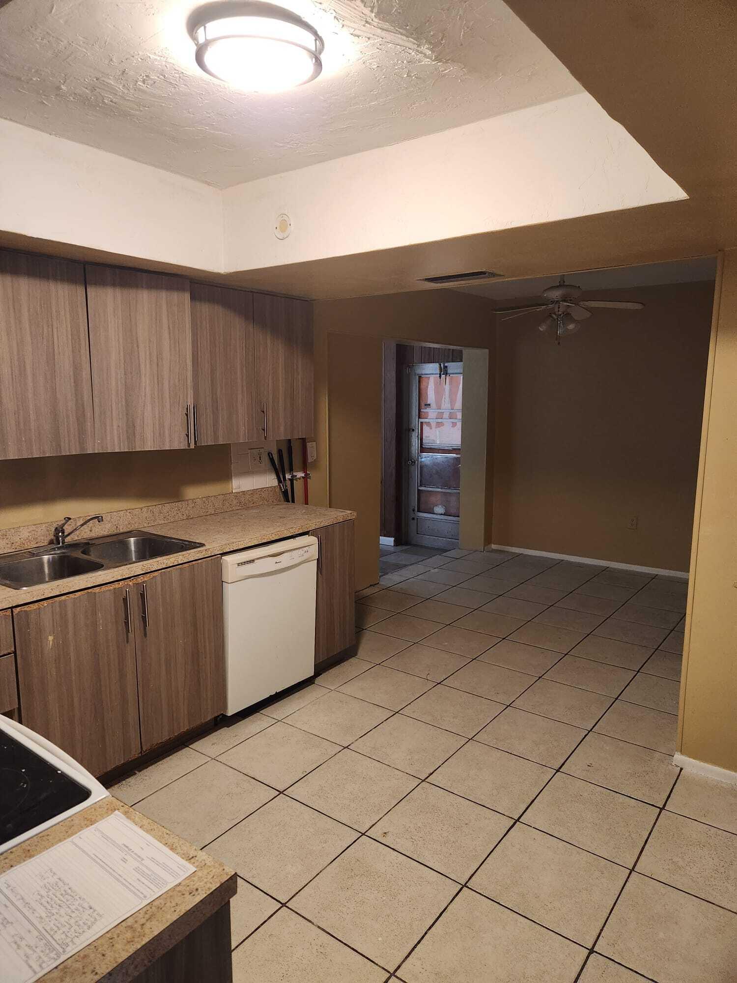 8030 Sunset Strip Sunrise, FL 33322 - Photo 2 of 8 a kitchen with a sink and cabinets