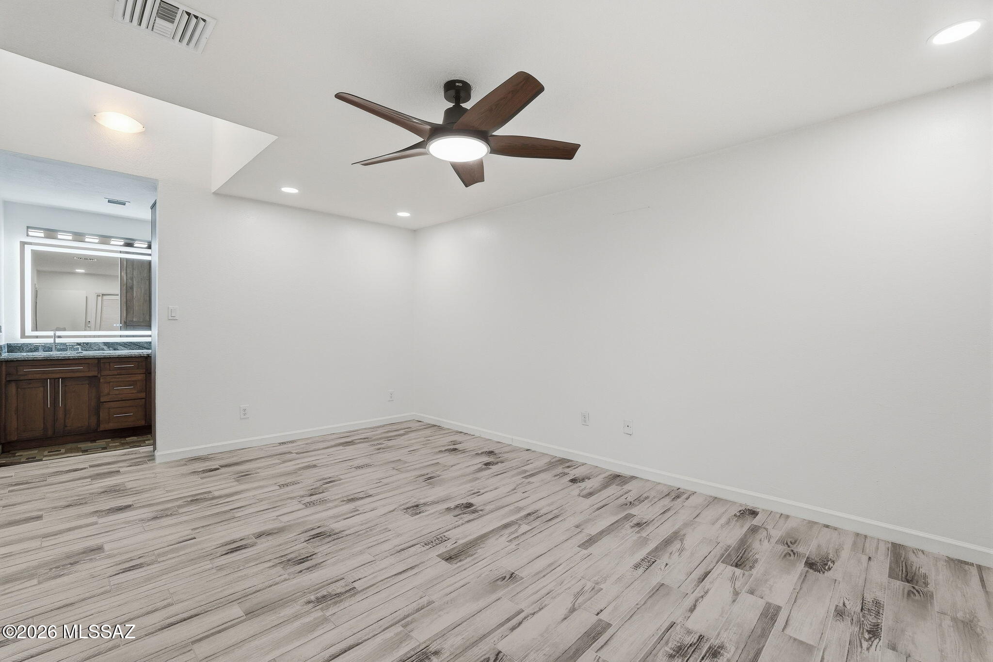 1183 Circulo Canario Rio Rico, AZ 85648 - Photo 11 of 31 wooden floor in an empty room