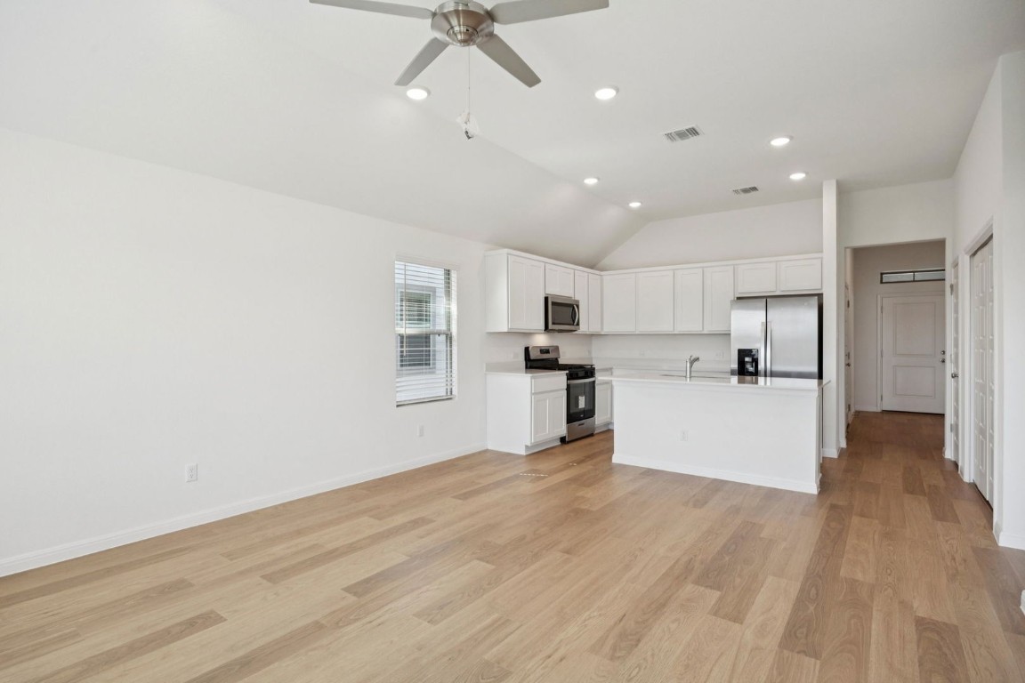 332 Bendecido Loop Elgin, TX 78621 - Photo 11 of 33 a view of a kitchen with microwave and cabinets