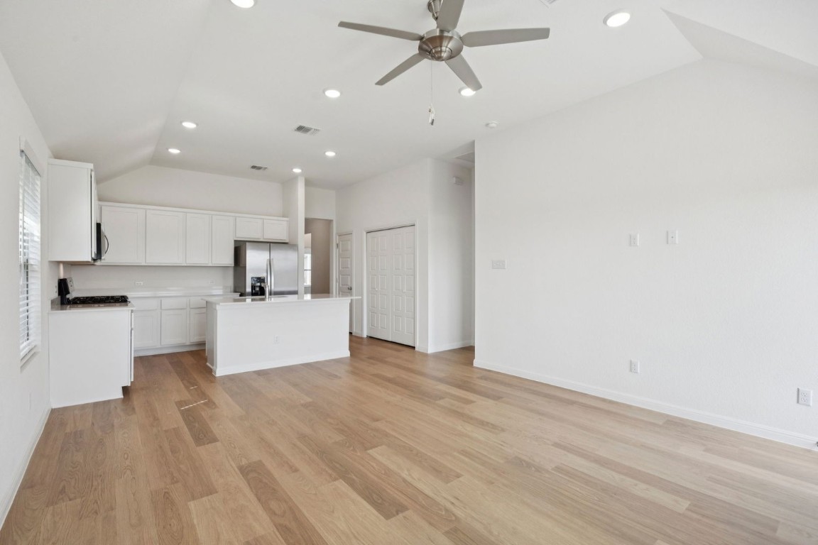 332 Bendecido Loop Elgin, TX 78621 - Photo 12 of 33 a view of kitchen with refrigerator microwave and white stove