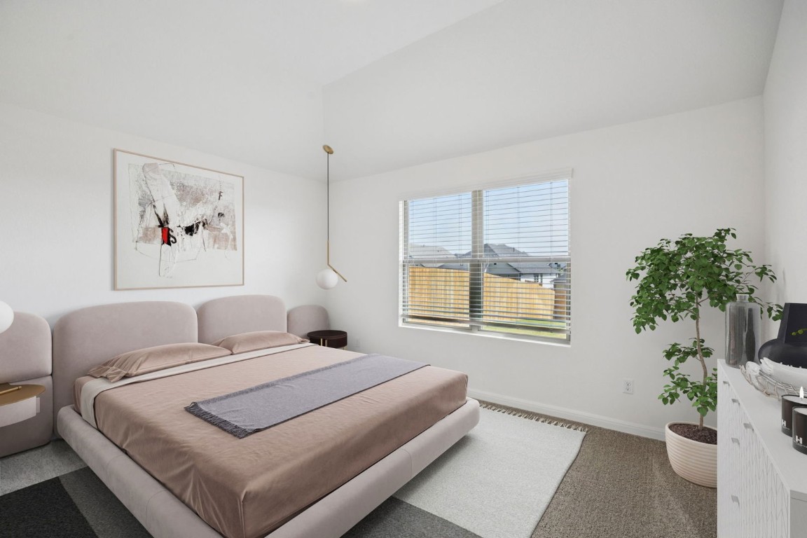 332 Bendecido Loop Elgin, TX 78621 - Photo 17 of 33 a bedroom with a large bed and a window