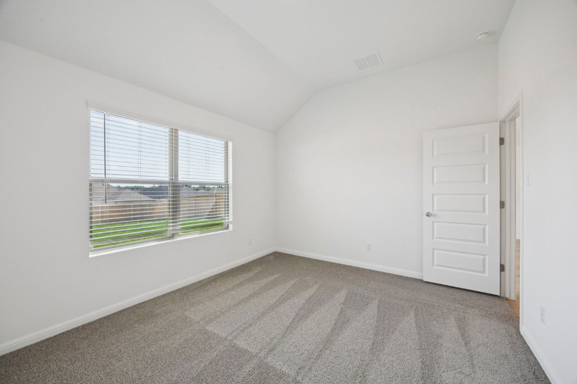 332 Bendecido Loop Elgin, TX 78621 - Photo 19 of 33 an empty room with a window