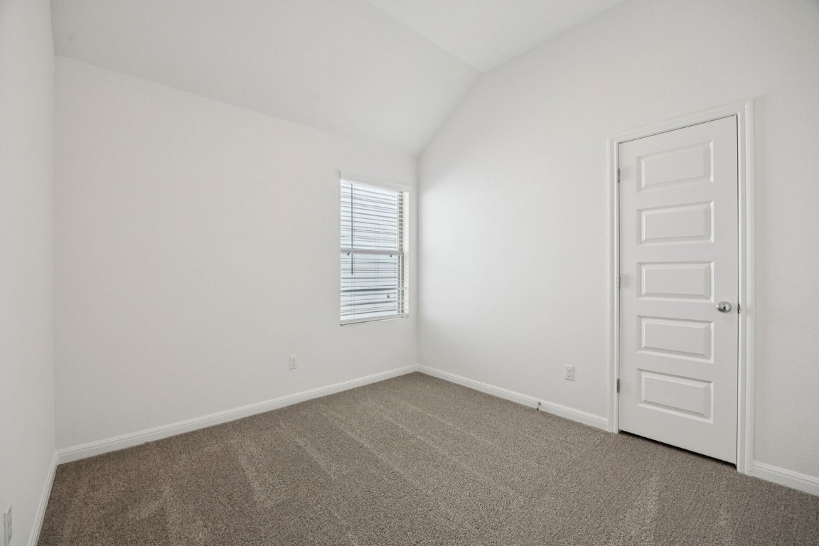 332 Bendecido Loop Elgin, TX 78621 - Photo 23 of 33 an empty room with windows