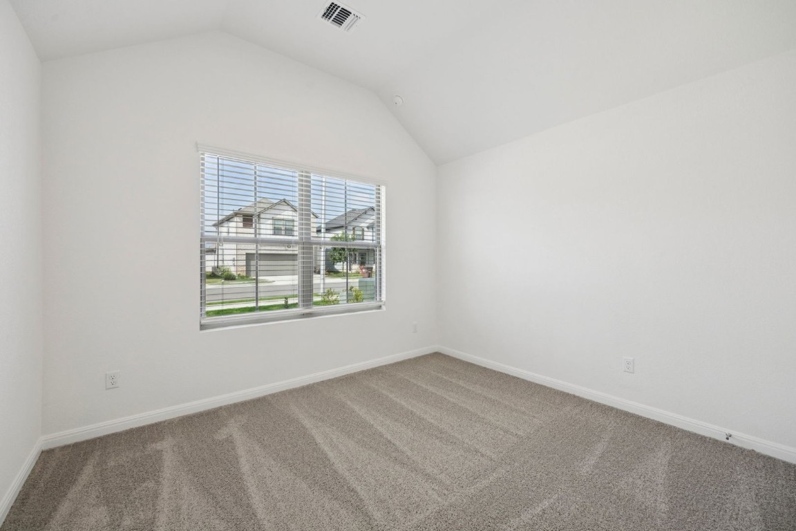 332 Bendecido Loop Elgin, TX 78621 - Photo 25 of 33 an empty room with windows