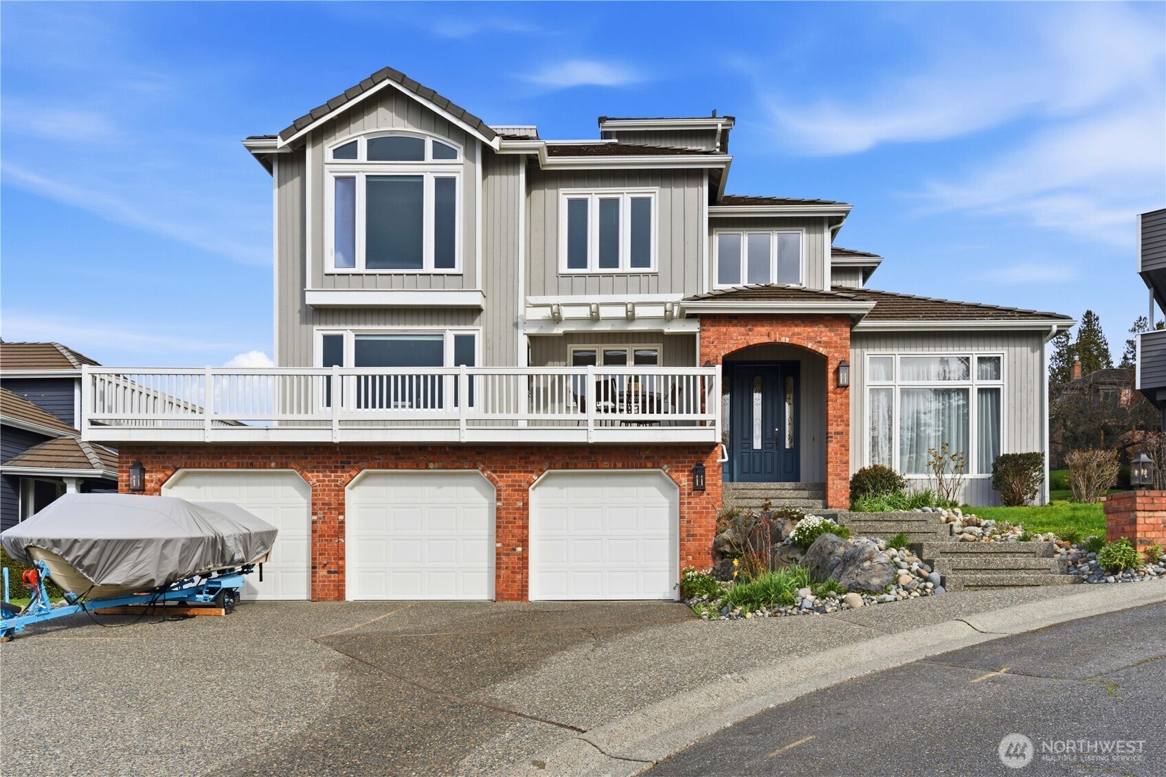 2626 Northwest 204th Street Shoreline, WA 98177 - Photo 1 of 35 a front view of a house with a yard and garage