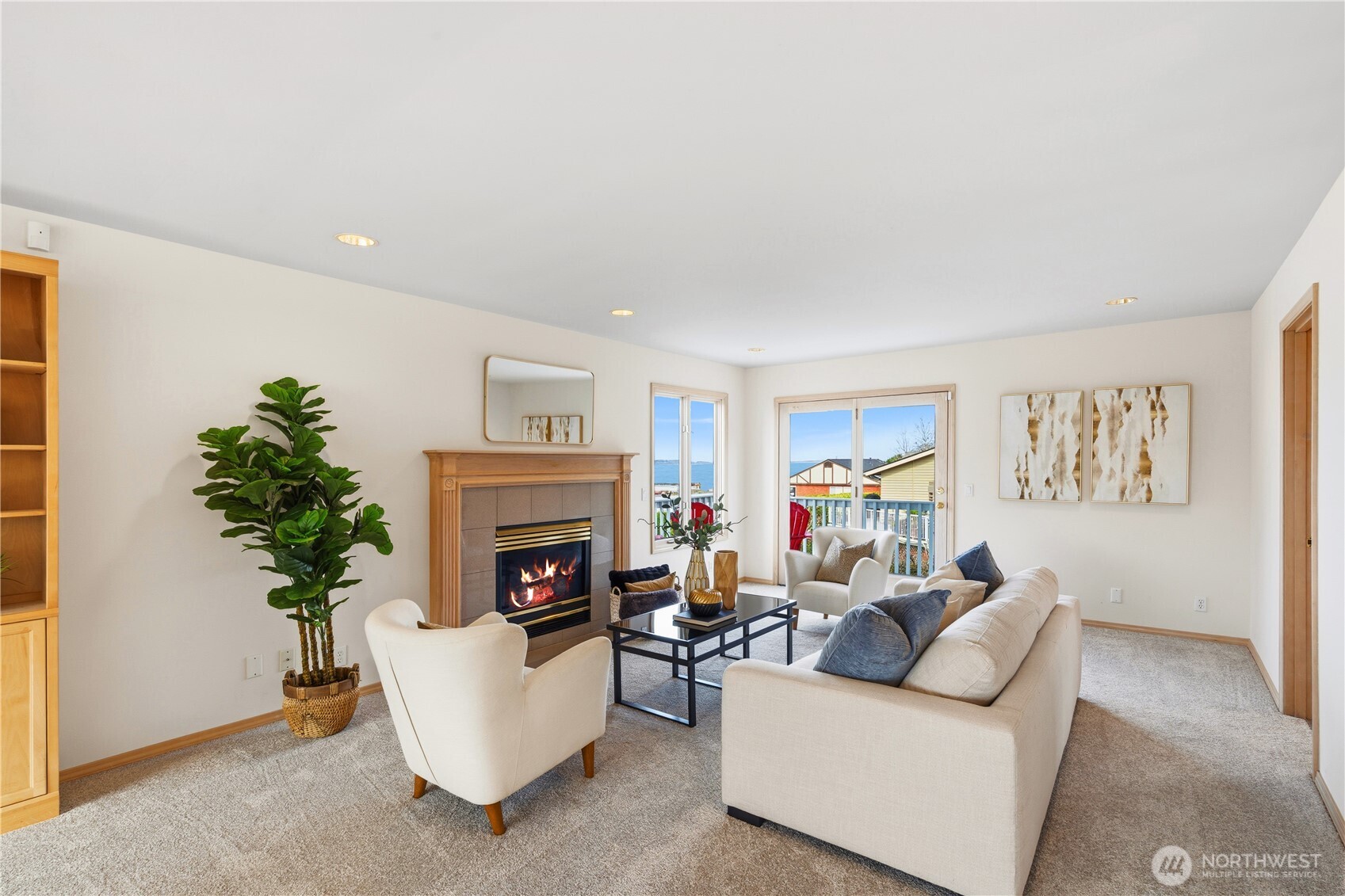 2626 Northwest 204th Street Shoreline, WA 98177 - Photo 13 of 35 a living room with furniture a fireplace and a potted plant