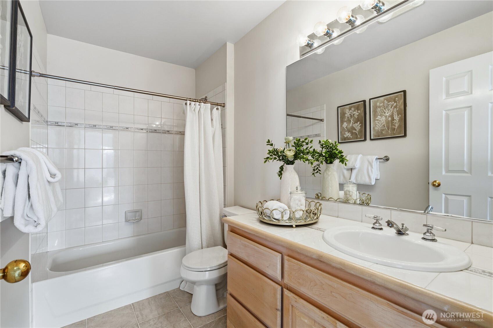 2626 Northwest 204th Street Shoreline, WA 98177 - Photo 18 of 35 a bathroom with a sink a toilet and a bathtub