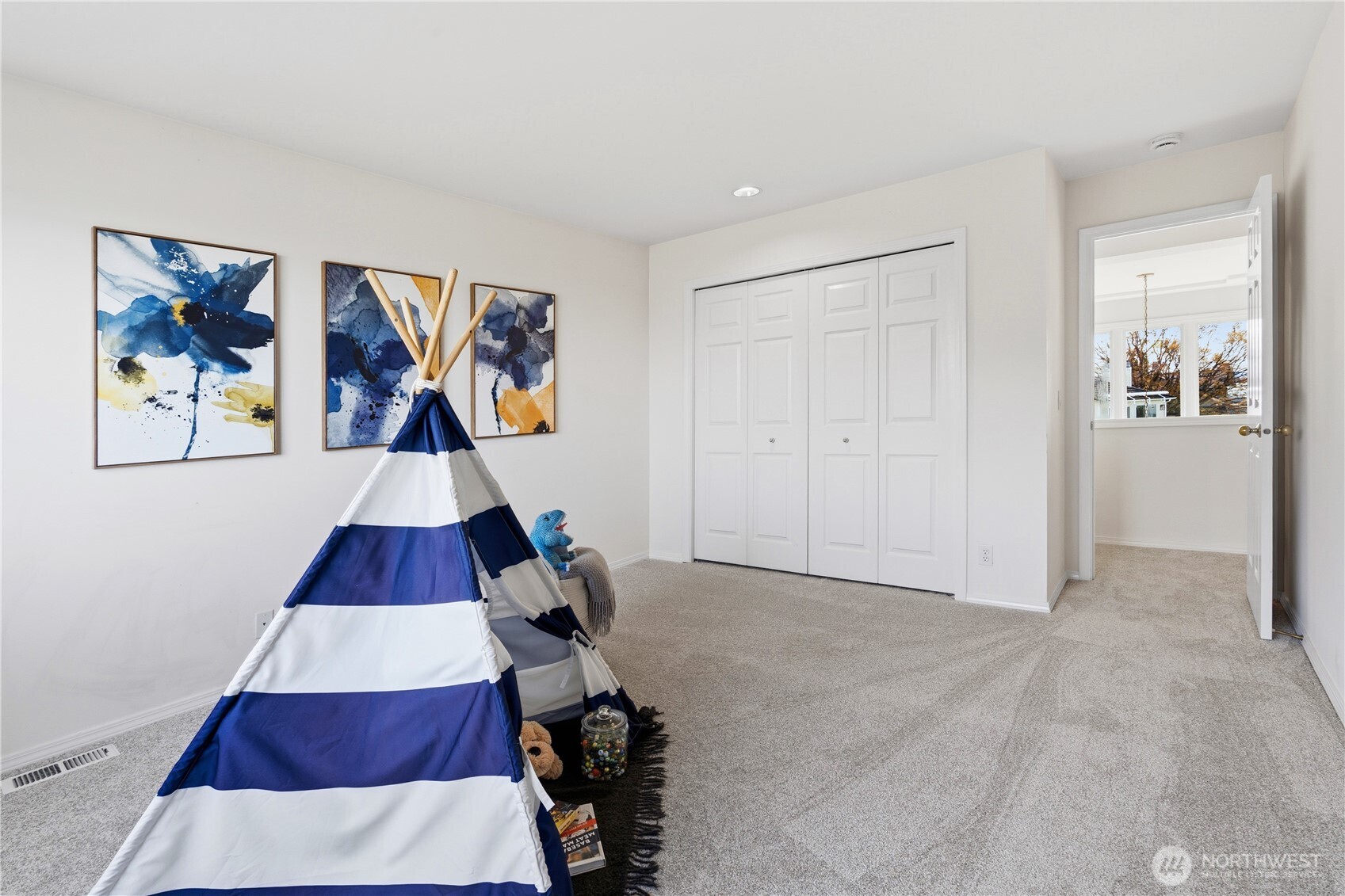 2626 Northwest 204th Street Shoreline, WA 98177 - Photo 20 of 35 a room that has a rug and a painting on the wall